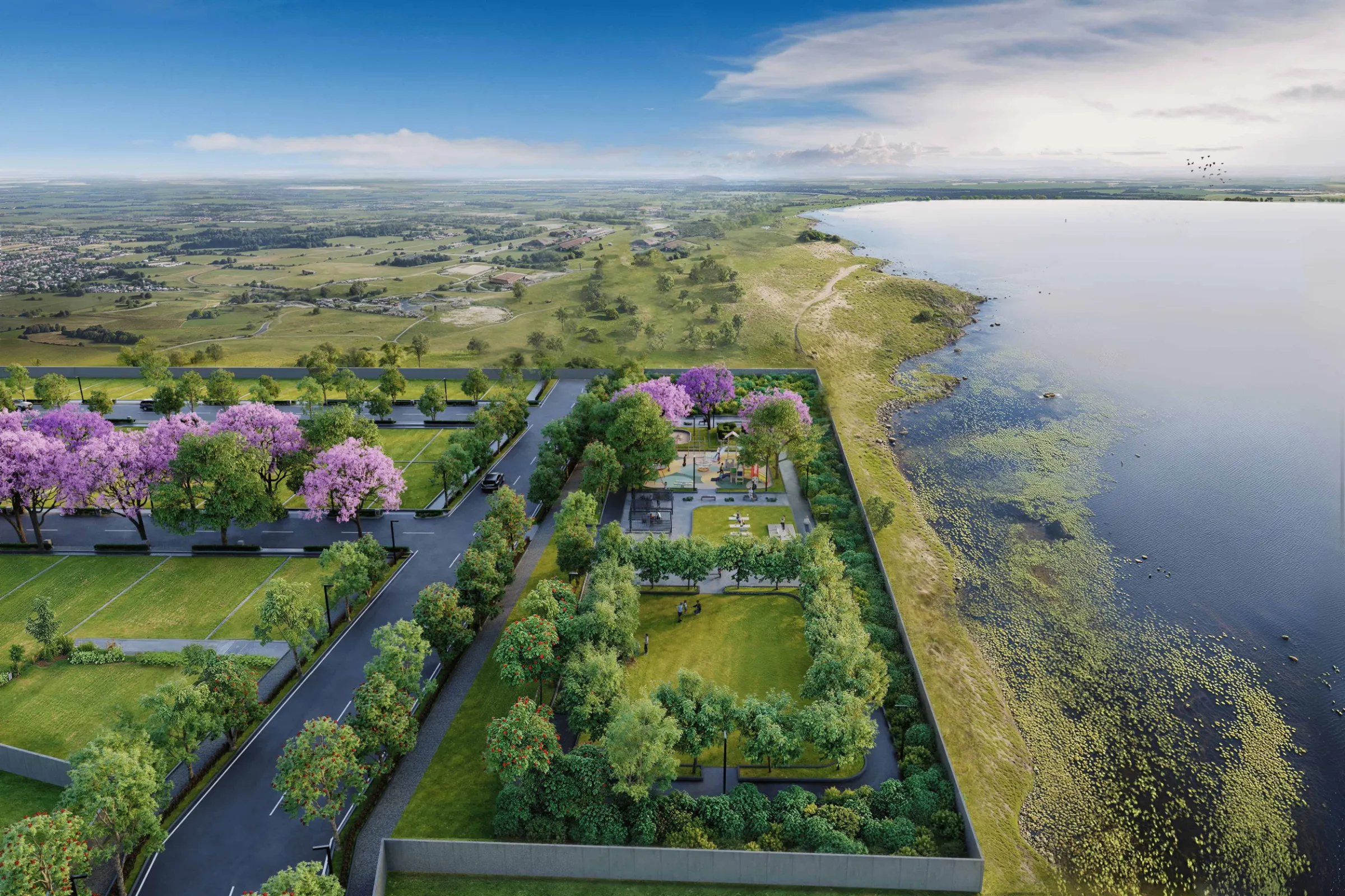 Aerial view of Abhee Hoskote plotted development near lake with landscaped roads and greenery in Bangalore